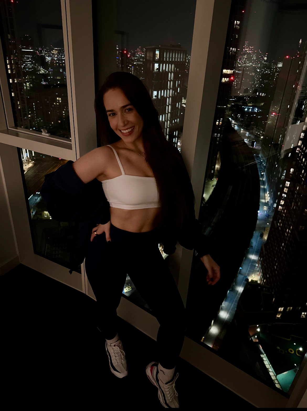 Kristina by the window at night